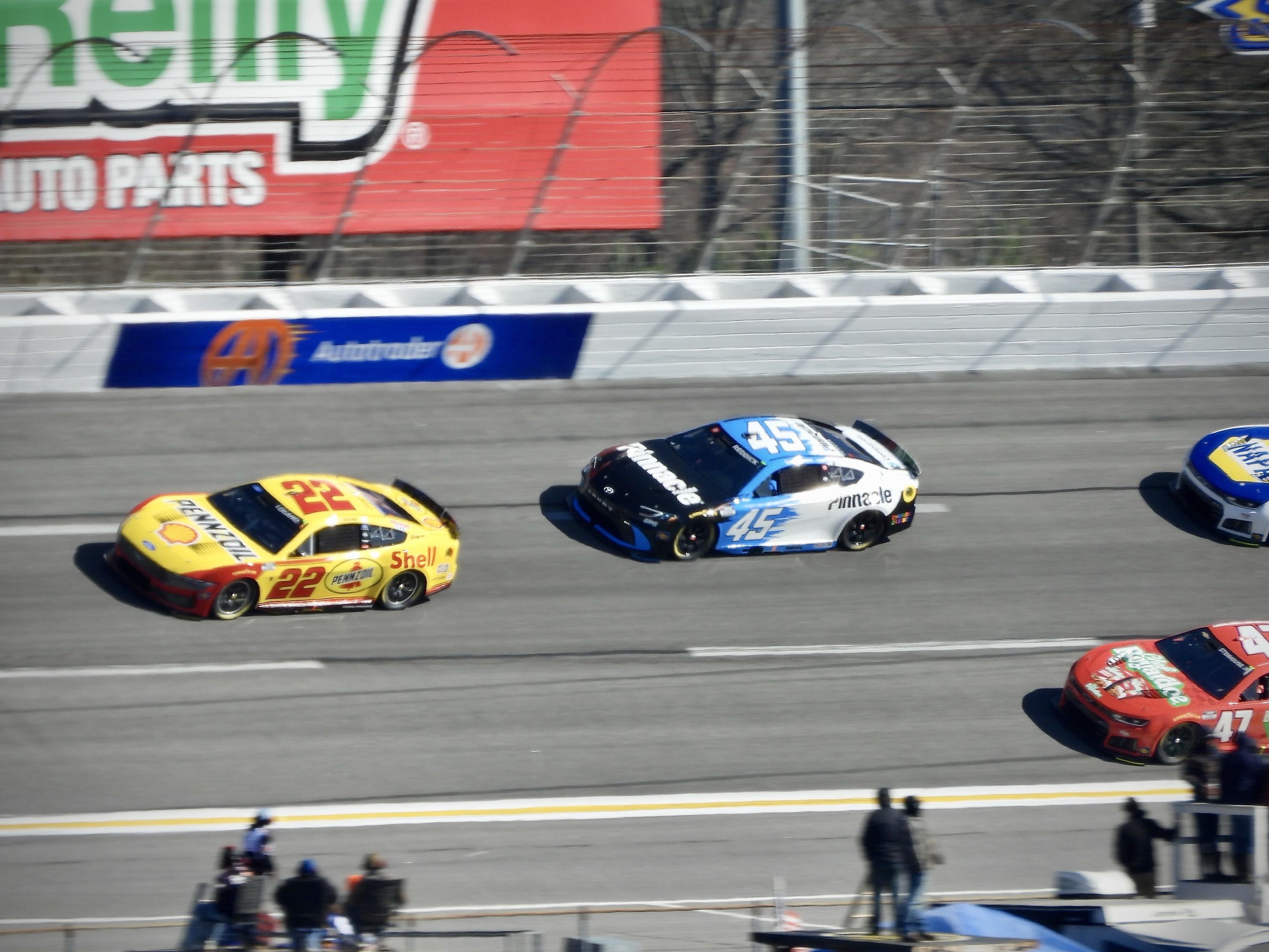Tyler Reddick chasing Joey Logano down the back stretch at EchoPark Speedway in Atlanta